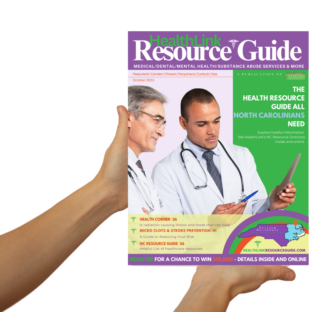 HealthLink Resource Guide Magazine cover being held with a pair of hands.